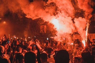 Photo by Maurício Mascaro: https://www.pexels.com/photo/anonymous-people-standing-on-street-among-smoke-during-protests-at-night-4636148/